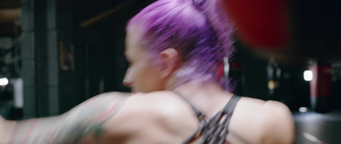 Woman jumps and practices punching