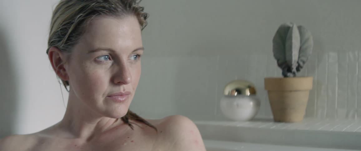 A woman is taking a bath