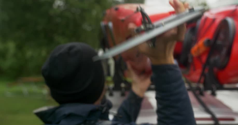 A person unloading a vehicle