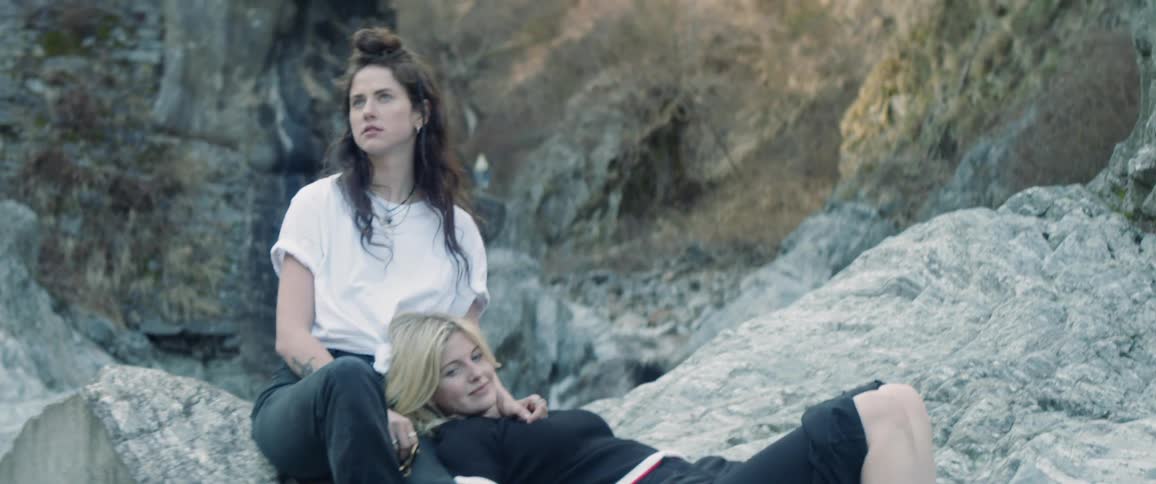 Two women resting on rocks