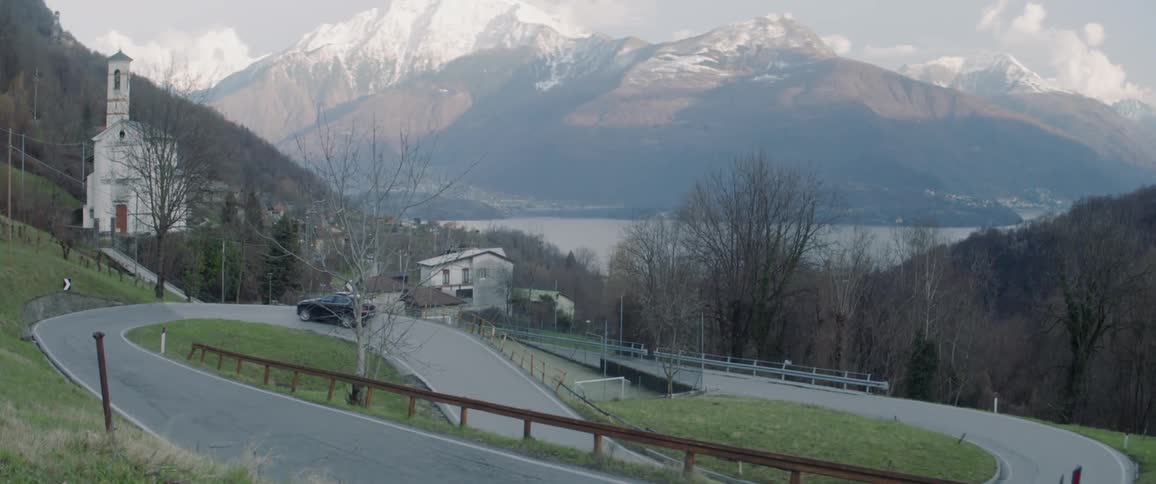 Car ascends winding road