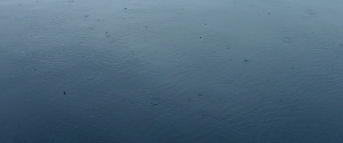 Rain drops on water