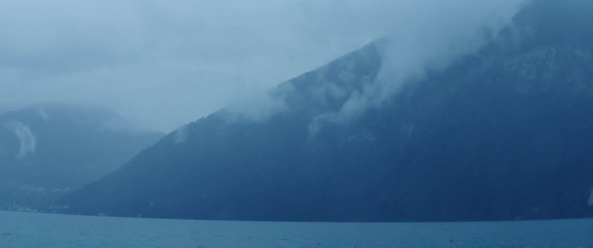 Mist over a mountain beside the ocean
