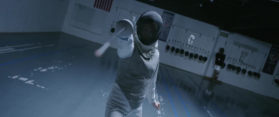 A fencer is pointing the sword forward