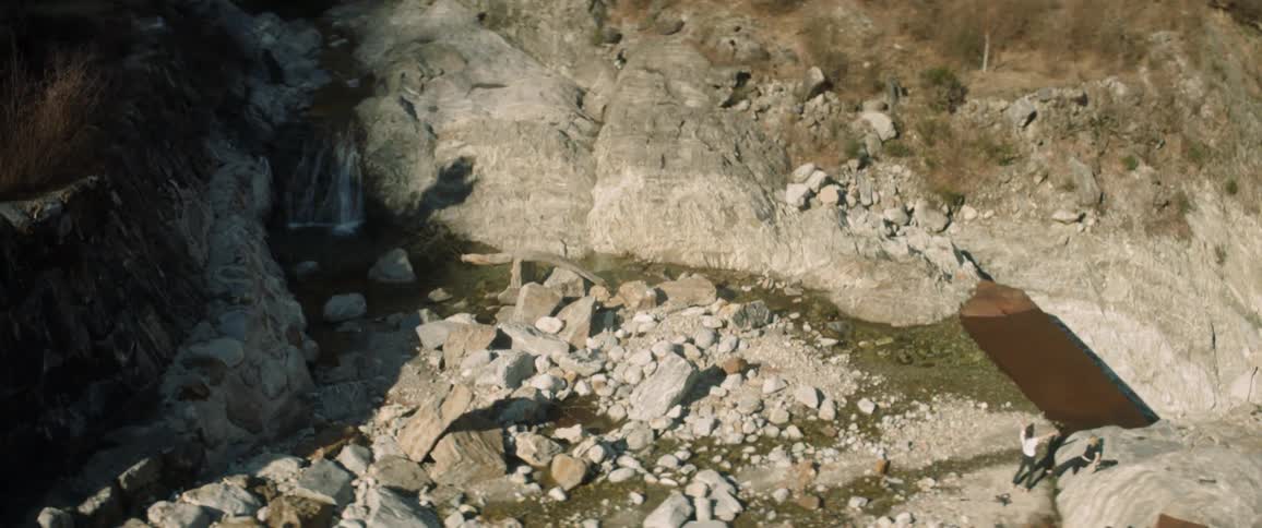 People climbing down rocks