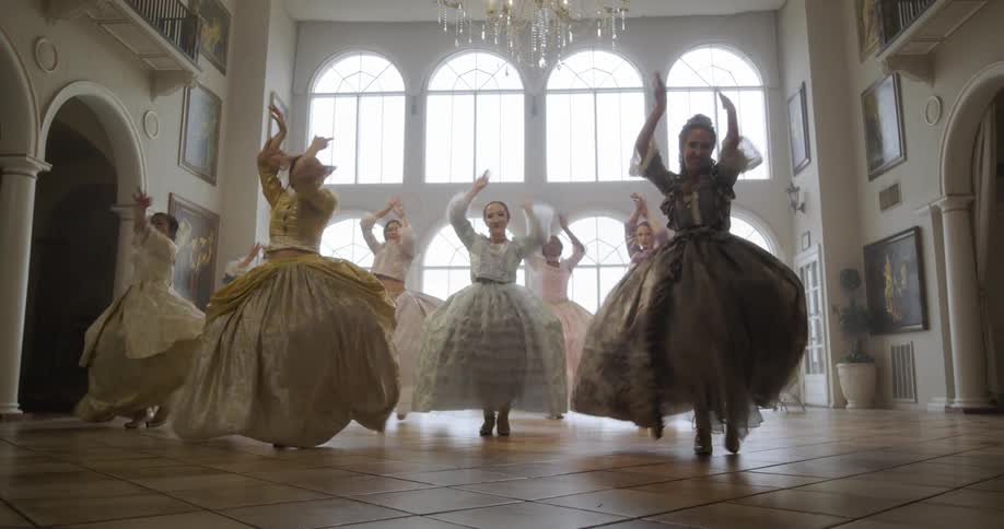 Women in period costumes dance