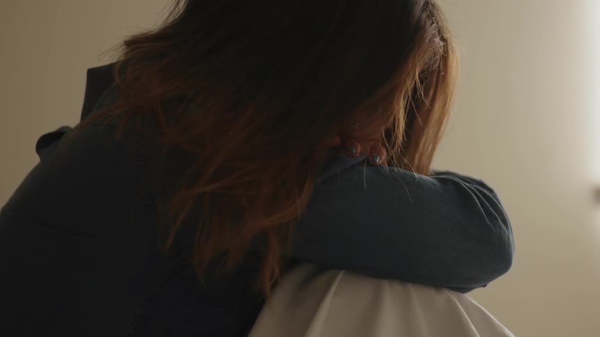 A person with their arms crossed