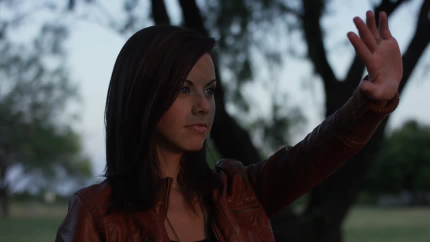 A person holding up their hand