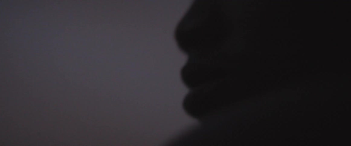 A man looks around in the dark