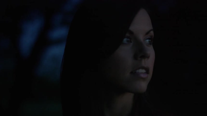 A person standing in the dark