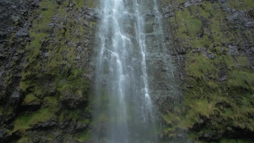 A waterfall rolling down a cliff side