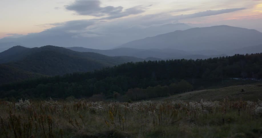 View of a grassy field and mountains