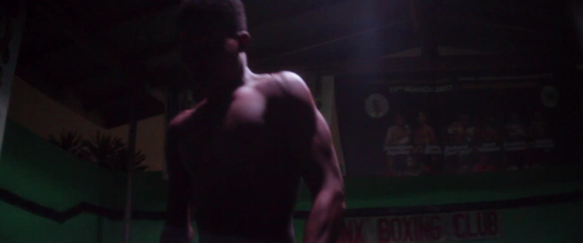 A man shadow boxes in the gym
