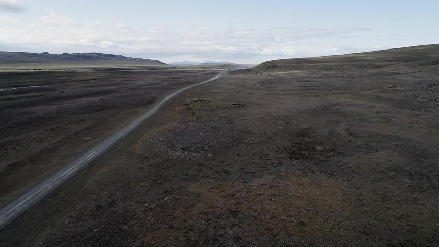Aerial view of a road through mountains