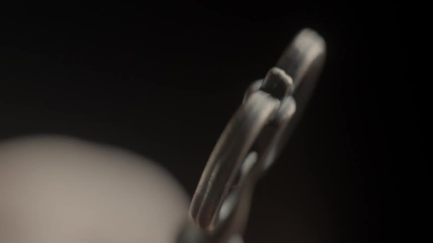 Skeleton key being twisted in a hand