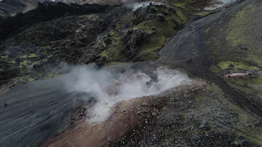 Steam is rising from the rocks