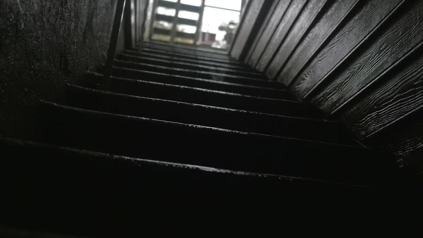Raindrops fall on outside stairs