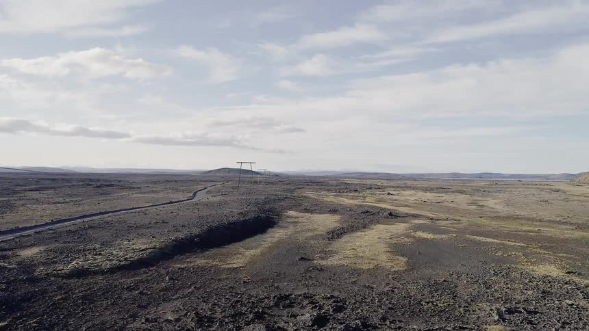 Power lines over a flat area of land