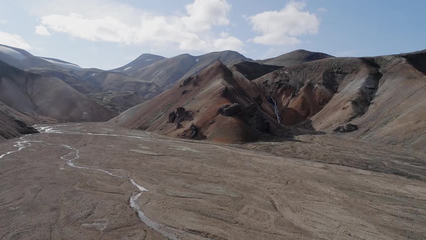 A river streams between the mountains