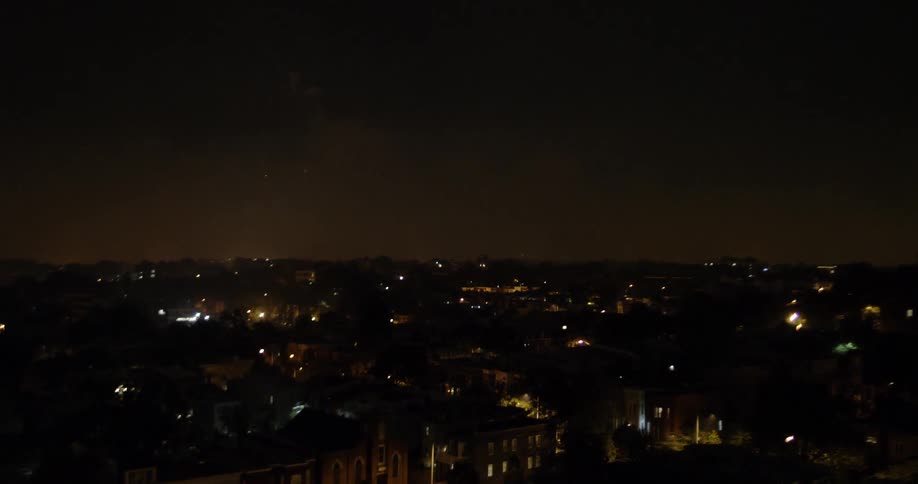 Fireworks explode in the night sky