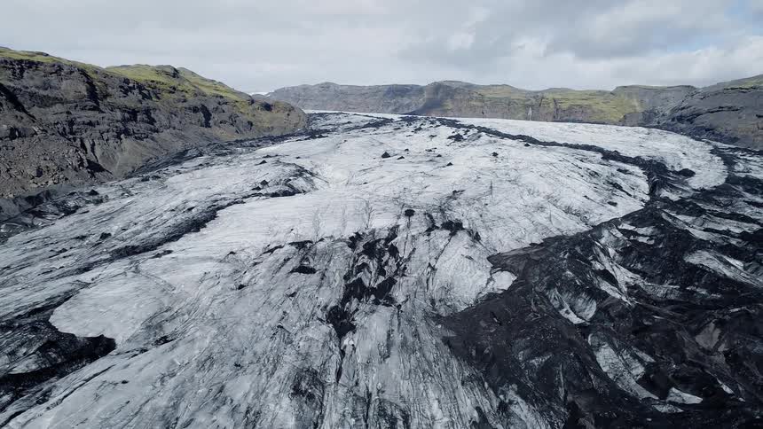 Snow and mud cover a mountain landscape