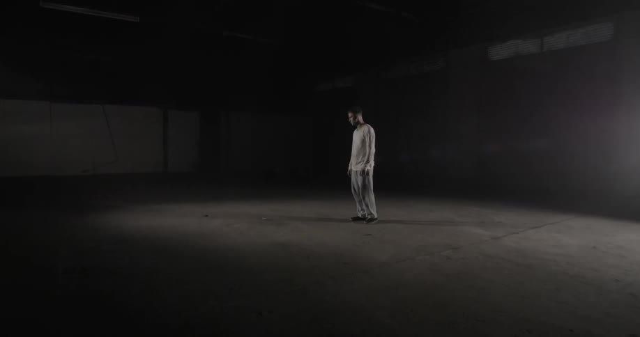 Man Alone In A Warehouse
