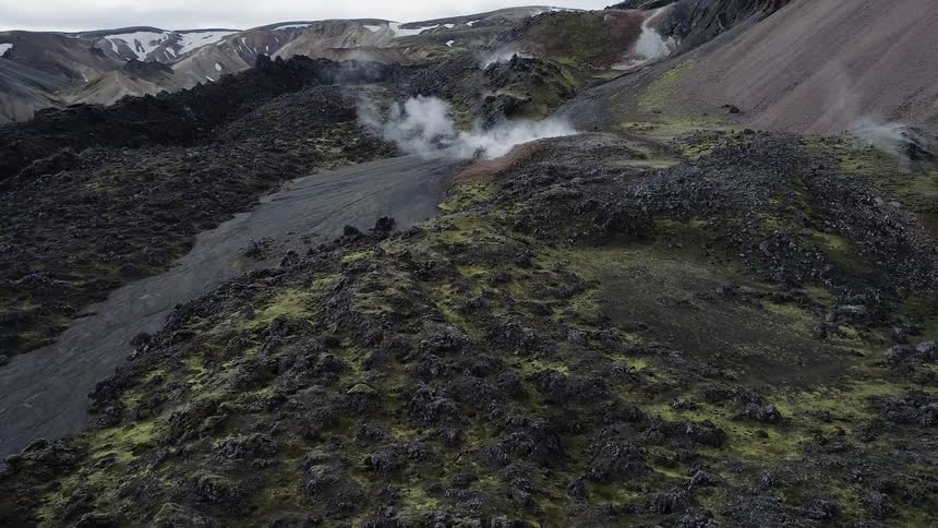 Steam pours from the ground