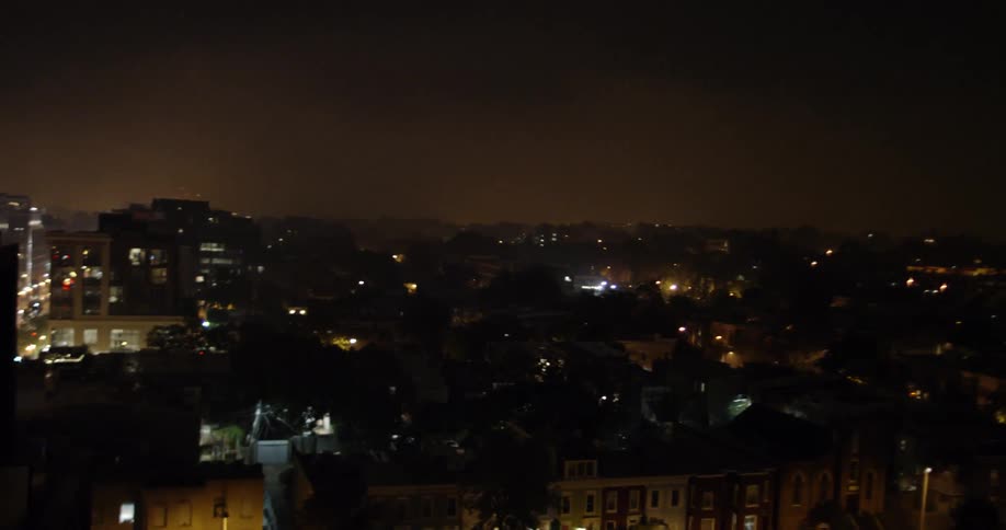 Fireworks explode above city buildings