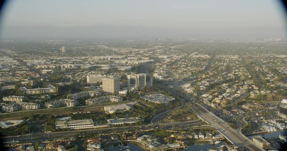 The city is covered with light fog