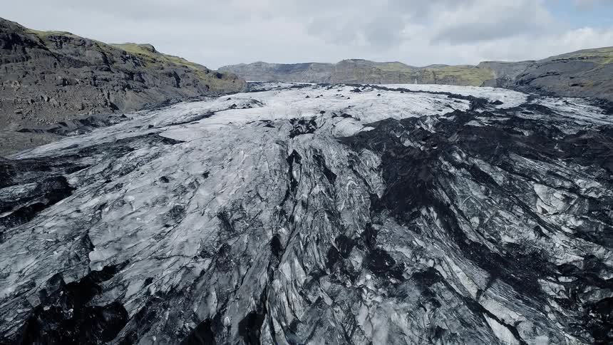 The hills are covered in ice and snow