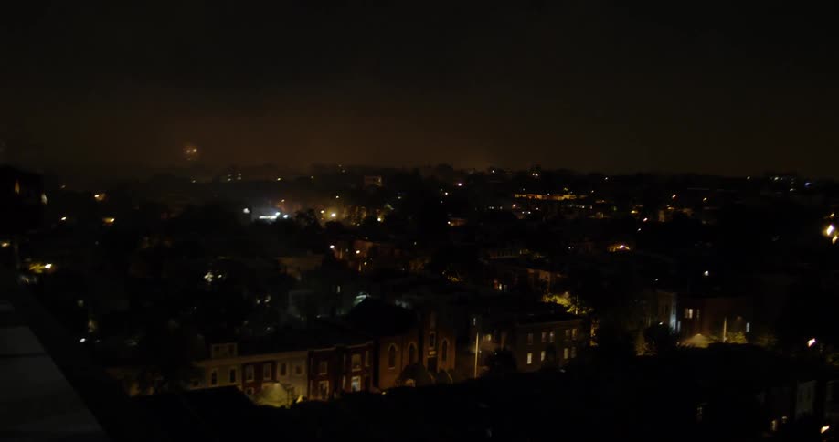 View of fireworks over a night city sky