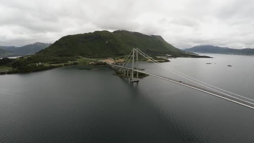 A vehicle crosses a bridge