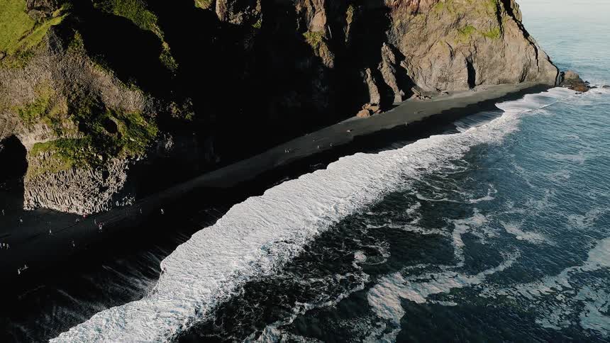 Aerial view of a batch next to a mountain