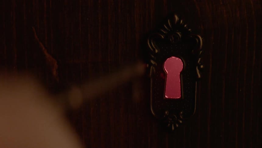 Person using skeleton key to open door