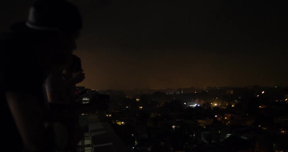 Fireworks explode over a city