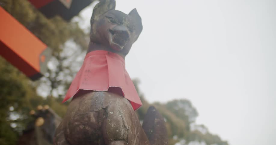 An animal statue is displayed by the walkway