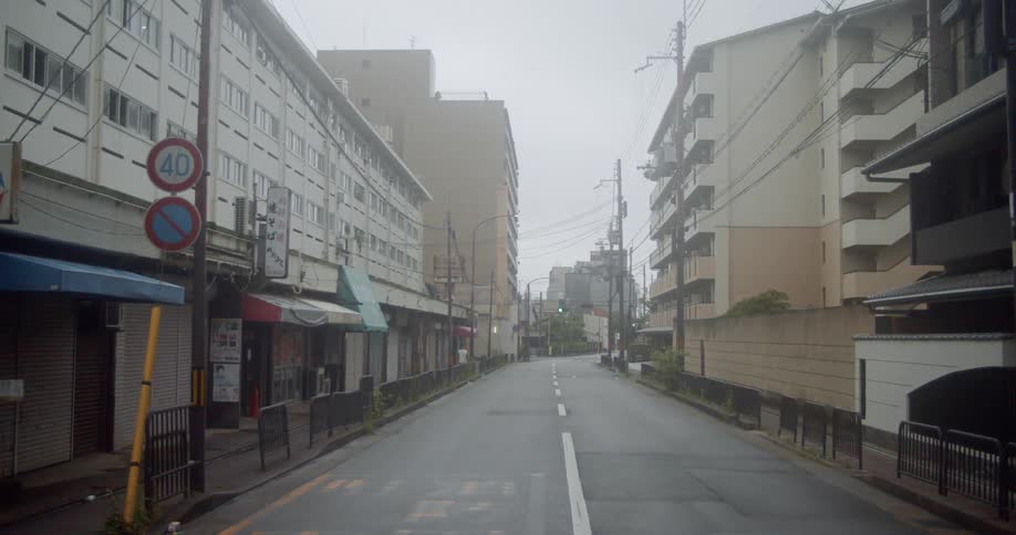 Buildings line each side of the city street