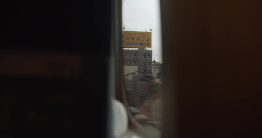 A person rides on a commuter train