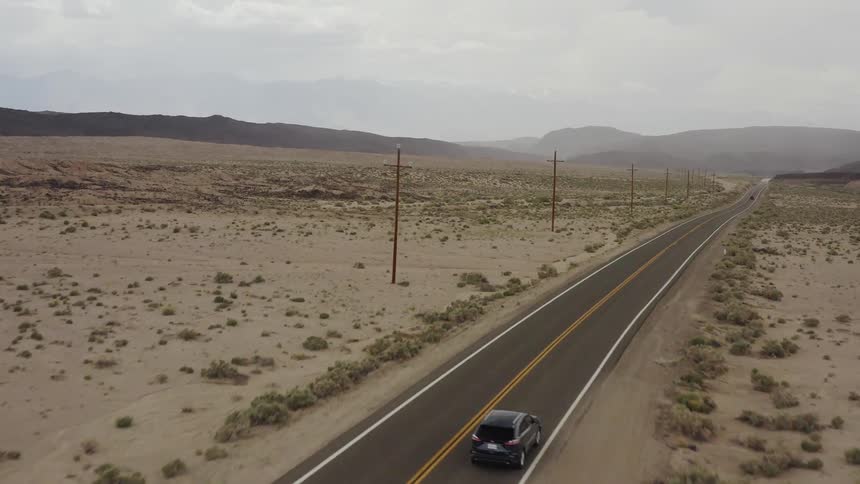 A truck drives down a rural road