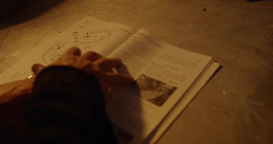 A man is flipping through a book
