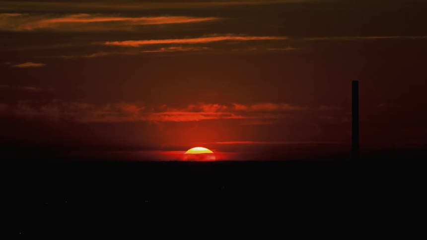 The sun sets turning the sky black