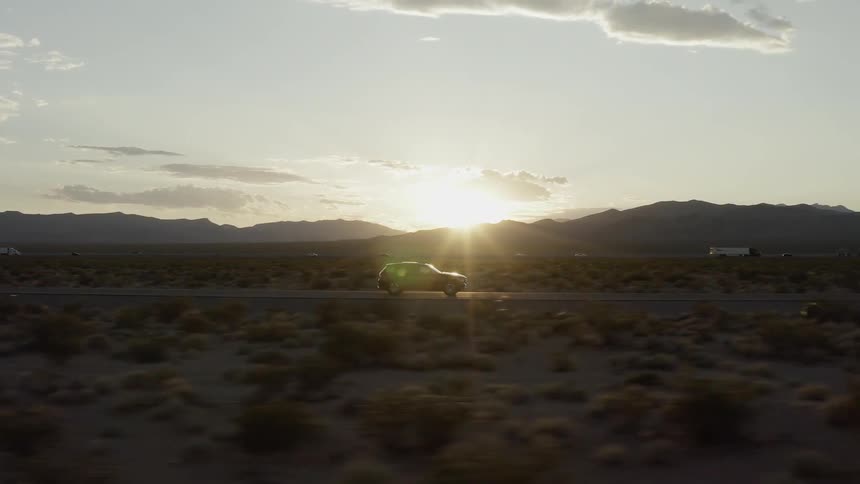 A truck travels on the rural road