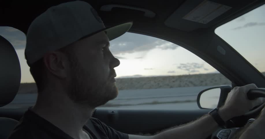 Man is driving down highway