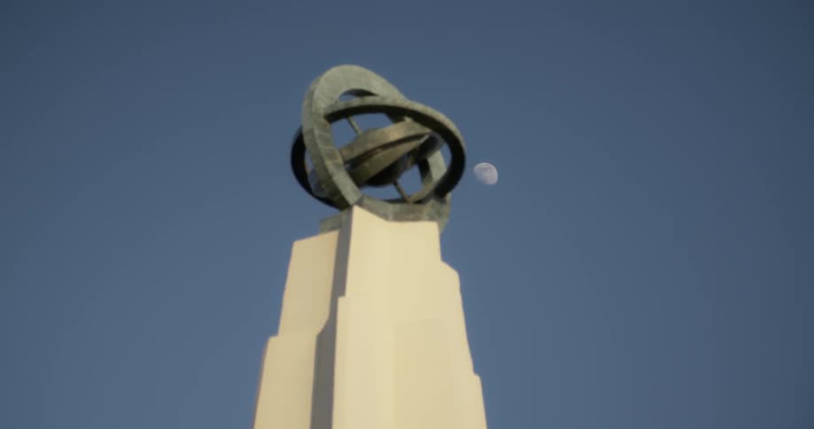 The statue is on a stone pillar