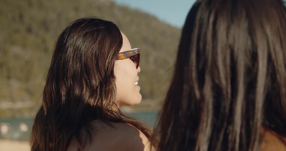 Woman is listening, smiling and talking with friend