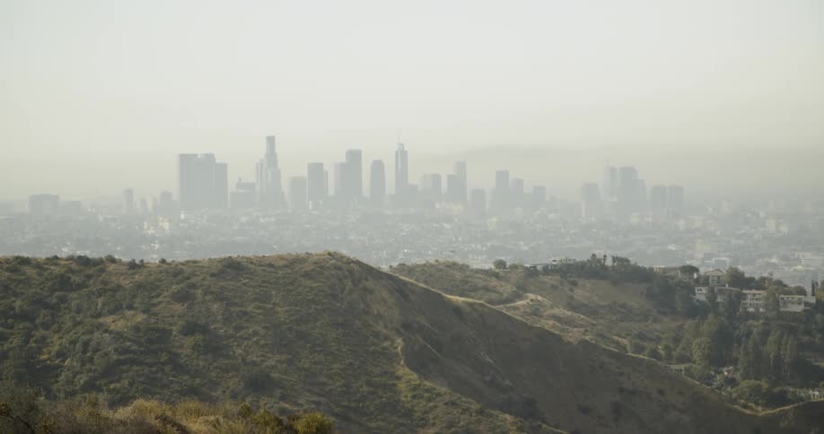 A cityscape is shown on a hazy day