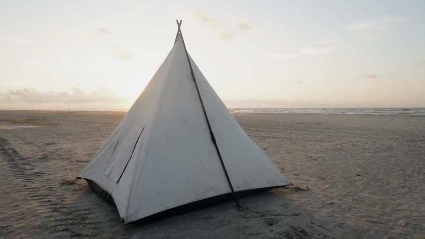 The tent is set on the beach
