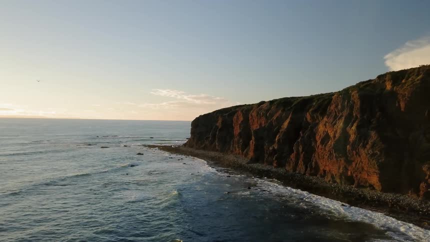 Ocean waves flow towards a shoreline