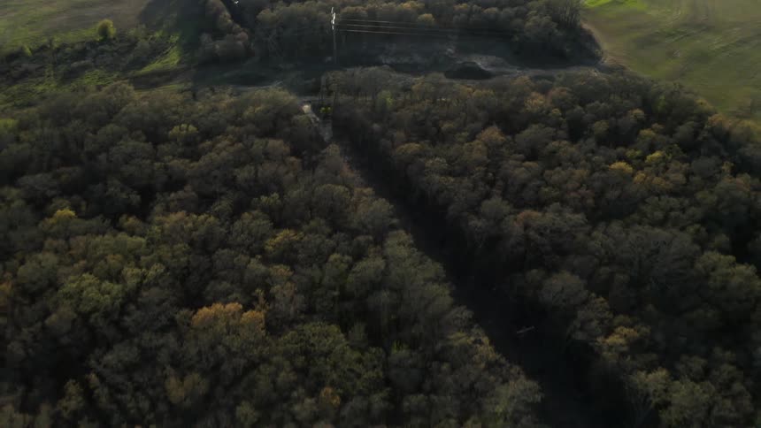 Trees cover a rural landscape