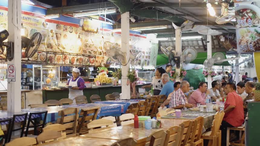People sit down eating in the restaurant
